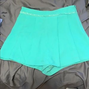 Mint green mini skirt with shorts underneath